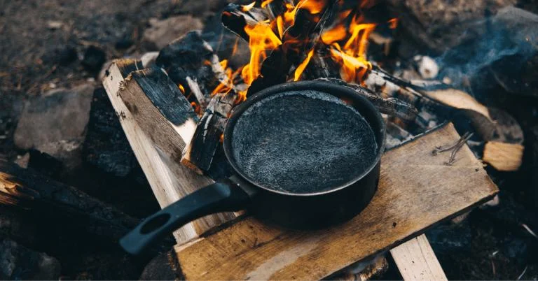 How to Use a Campfire to Boil Water Safely in the Wilderness