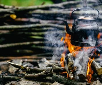How to Use Campfire Heat to Boil Water Safely While Camping