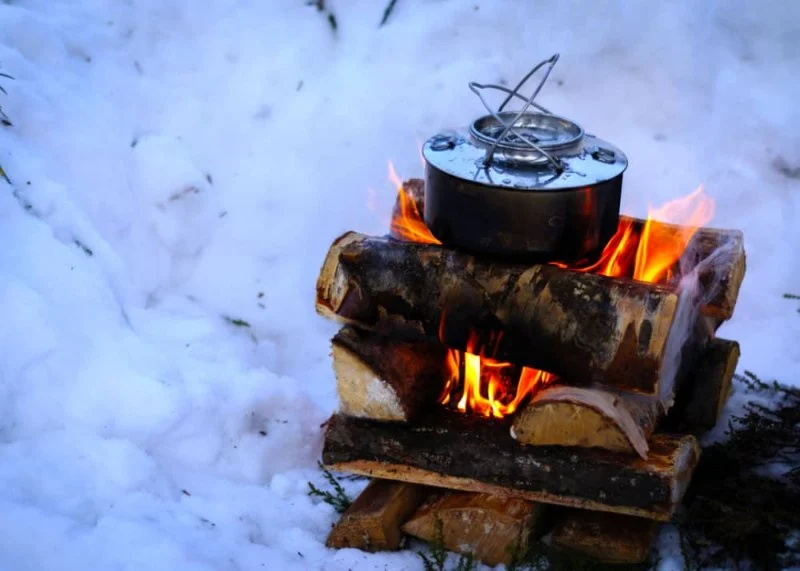 How to Use Campfire Heat to Melt Snow for Water