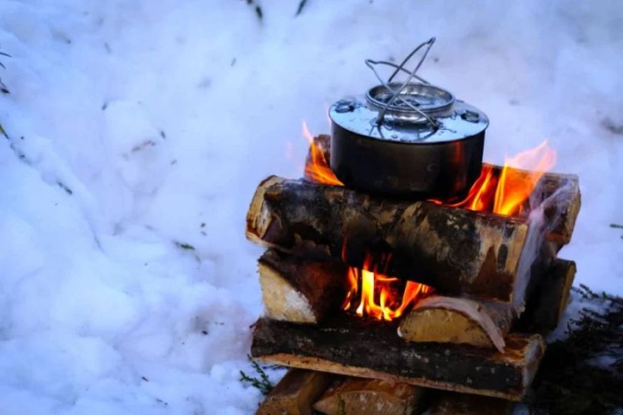 How to Use Campfire Heat to Melt Snow for Water
