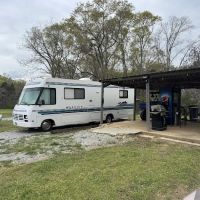 Back Yard Camping Near The Lake ico