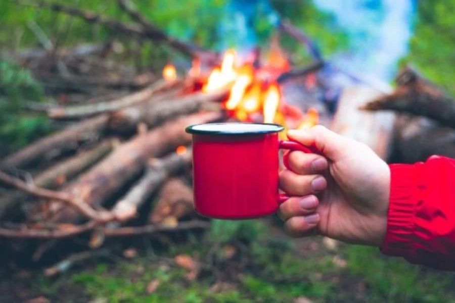 How to Use a Campfire to Heat Water for Tea and Coffee