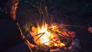 How to Use Campfire Heat to Dry Firewood Effectively and Safely