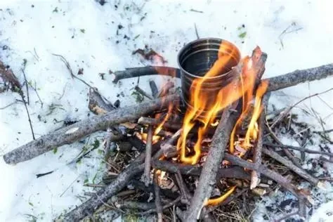 How to Use Campfire Heat to Melt Snow for Water Safely and Efficiently
